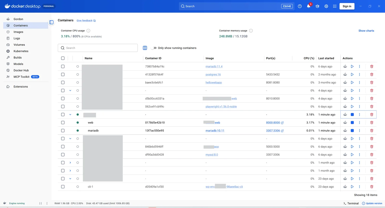 Docker Desktop listing the running containers for the platform, including a MariaDB 10.11 service. Project and container names redacted.